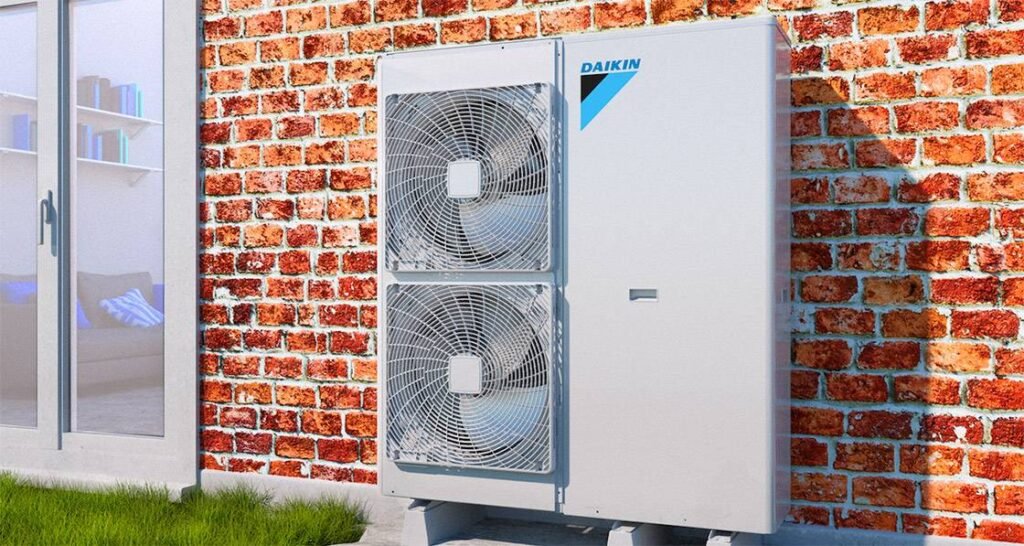 daikin heat pump unit in front of a red brick wall